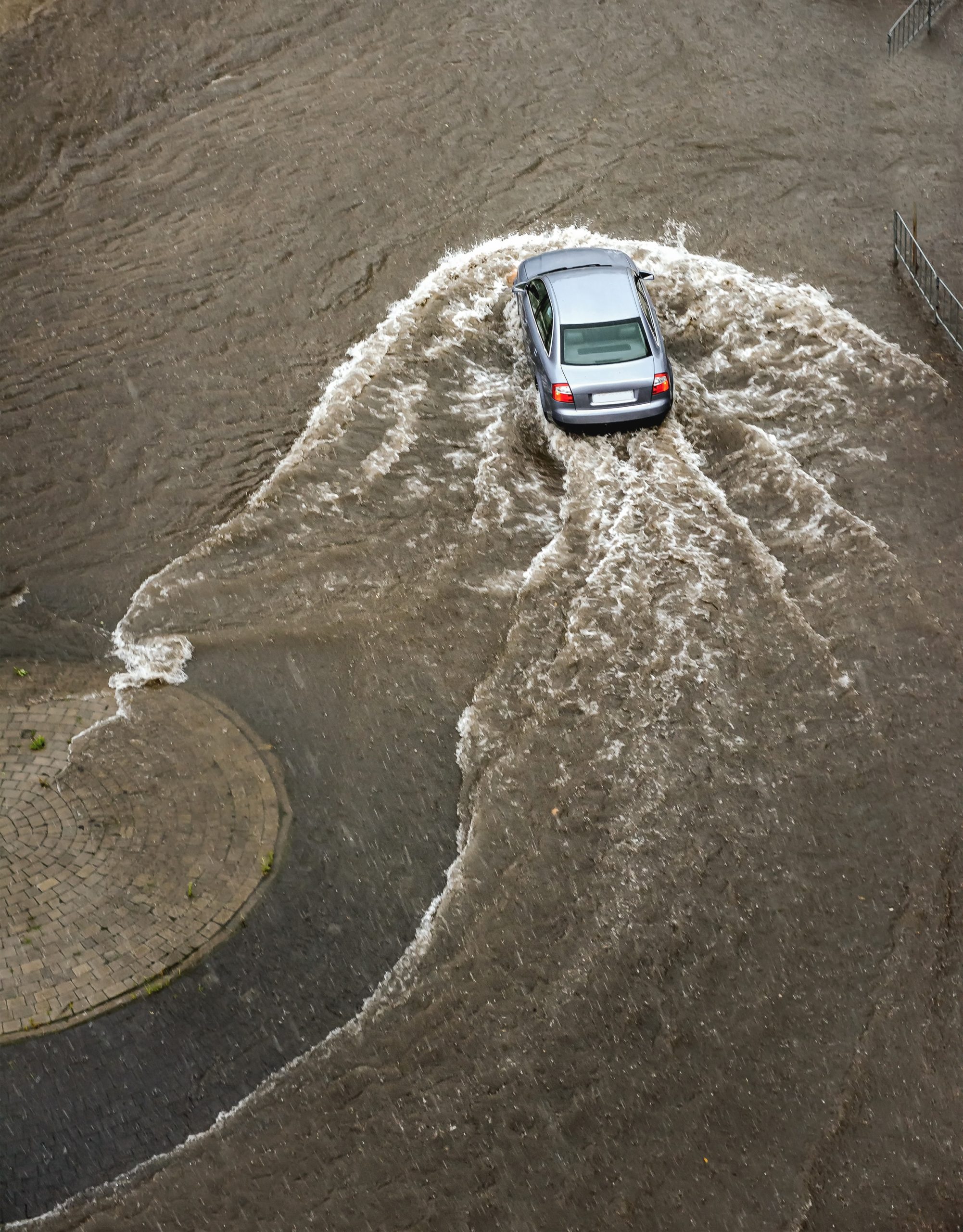 Car driving through flooded road